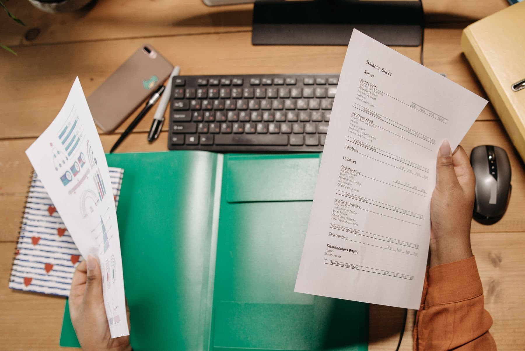 Balance sheets and financial statements laid out for review
